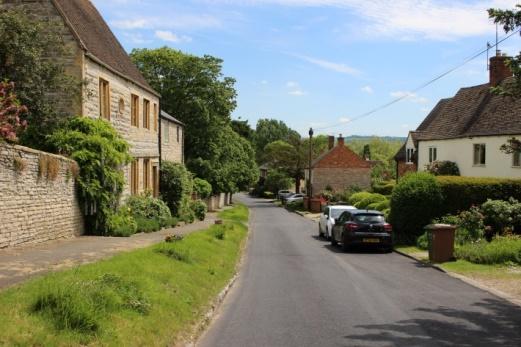 Elevated view down Front Street of buildings within the Conservation Area framing Meon Hill in the distance. 3.