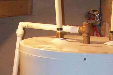 The water will flow out the discharge pipe. Don t scald yourself! Your home may be equipped with a fuel-burning (gas) water heater.