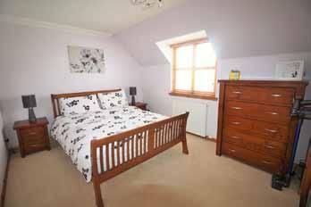 Built in double wardrobe, fronted by sliding mirror doors, offering hanging and shelved storage. Double radiator. Bedroom 2-12 3 (3.