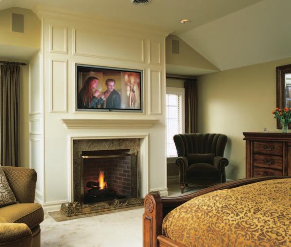 C H E C K I N O F F T H E W I S H L I S T S In the master bedroom, a Fujitsu 50-inch plasma display is shielded from the fireplace heat by an extra large mantle, while two Sonance inwall speakers are