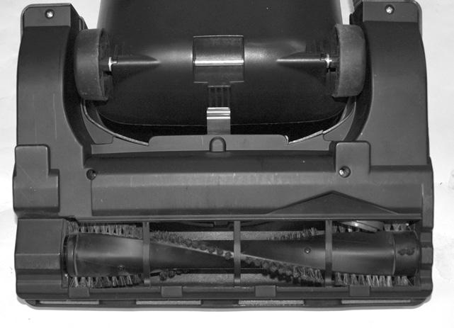 Place vacuum cleaner in the low position by pressing the handle release pedal twice. Remove the bottom plate as described above. 2.