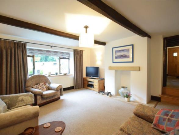 LIVING ROOM 15'2" x 15'8" (462m x 478m) Benefitting from a wealth of natural light to the front elevation There is a central heating radiator, exposed timbers to the ceilings, a decorative