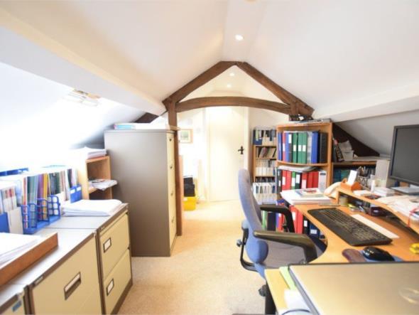 BEDROOM FOUR 14'8" x 11'2" (447m x 340m) Currently dressed as a home office, featuring a wealth of storage under the eaves There are three Velux skylights with inbuilt blinds, inset spotlighting to