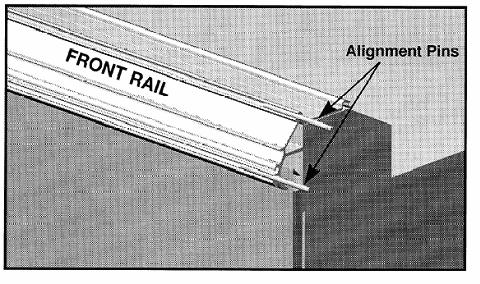 Align the case front rails with a single alignment pin sliding the pin across the joint into the adjoining front rail.