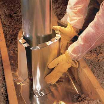 Don t use spray foam. Form an insulation dam to prevent insulation from contacting the flue pipe. Cut enough aluminum from the coil to wrap around the flue plus 6 inches.