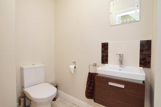 dryer, back door to gardens, service door to garage. CLOAKROOM: SEPARATE WC: Low flush WC, wash hand basin with mixer tap, extractor fan. BEDROOM (1): 13' 4" x 10' 7" (4.06m x 3.