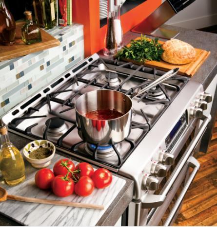 Flanges on the left, right, and back of the cooking surface overlap onto the countertop and act as a crumb guard between the edge of the countertop and the range.