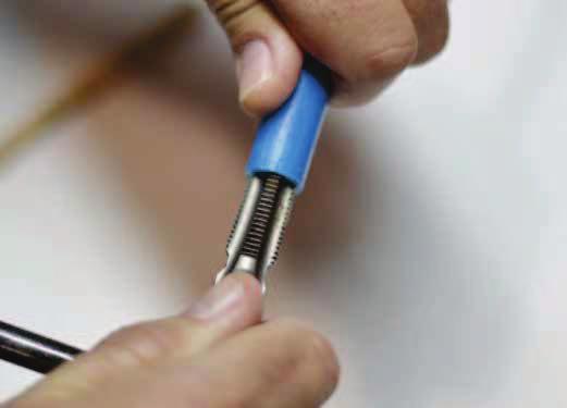 . Remove any plastic debris inside with needle nose pliers to avoid leaking.