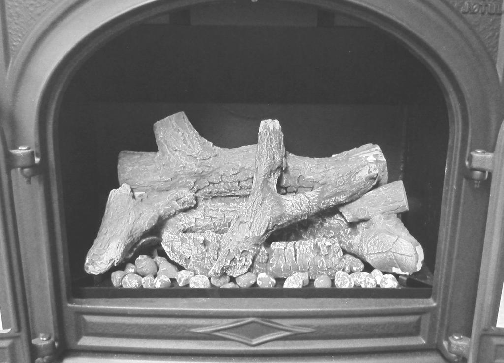 Figure 41. Position the Middle Cross Log as shown. Figure 42. Place Ember Stones loosely over the burner plate. DO NOT OBSTRUCT THE GAS PORTING. SEE FIG. 43. Use the supplied rock wool sparingly.