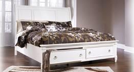 (76/78/95) Queen Storage Bed (74/77/98) No box spring B693 Demarlos (Signature Design) Traditional bedroom finished with antique white parchment color with the natural beauty of oak