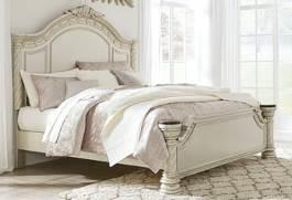 Mansion poster bed features a silver/gray fabric tufted with faux crystals Panel bed has ornamental crown moldings and natural marble caps Velvet upholstered bed is tufted with