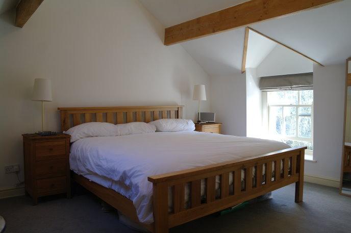 Single panelled central heating radiator, large three-door storage cupboard and two high loft storage cupboards.