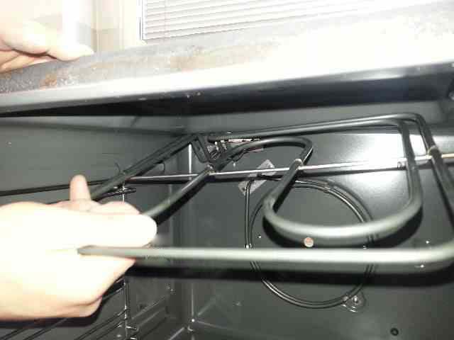 Remove the nuts securing the heater to the oven chamber.