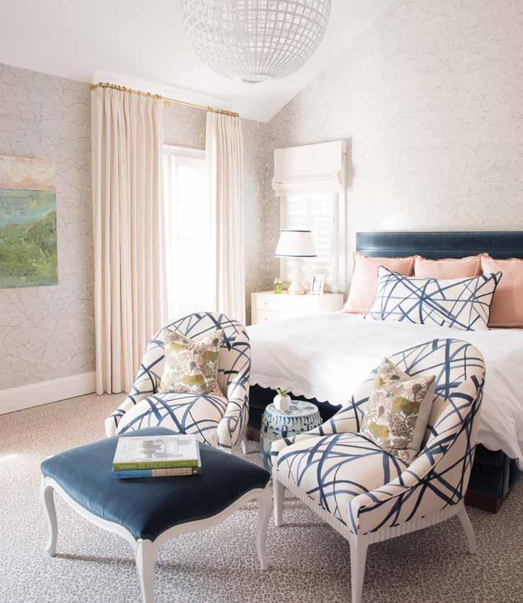 A pair of heirloom chairs recovered in Channels fabric by Kelly Wearstler for Groundworks tie in and anchor the bed in this cozy master bedroom.