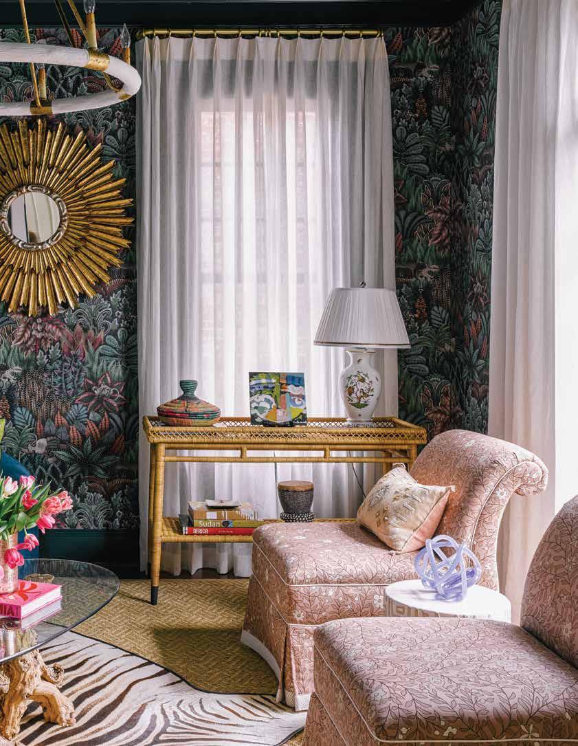 The beloved jungle room is full of treasures and covered in Cole & Son Ardmore wallcovering.