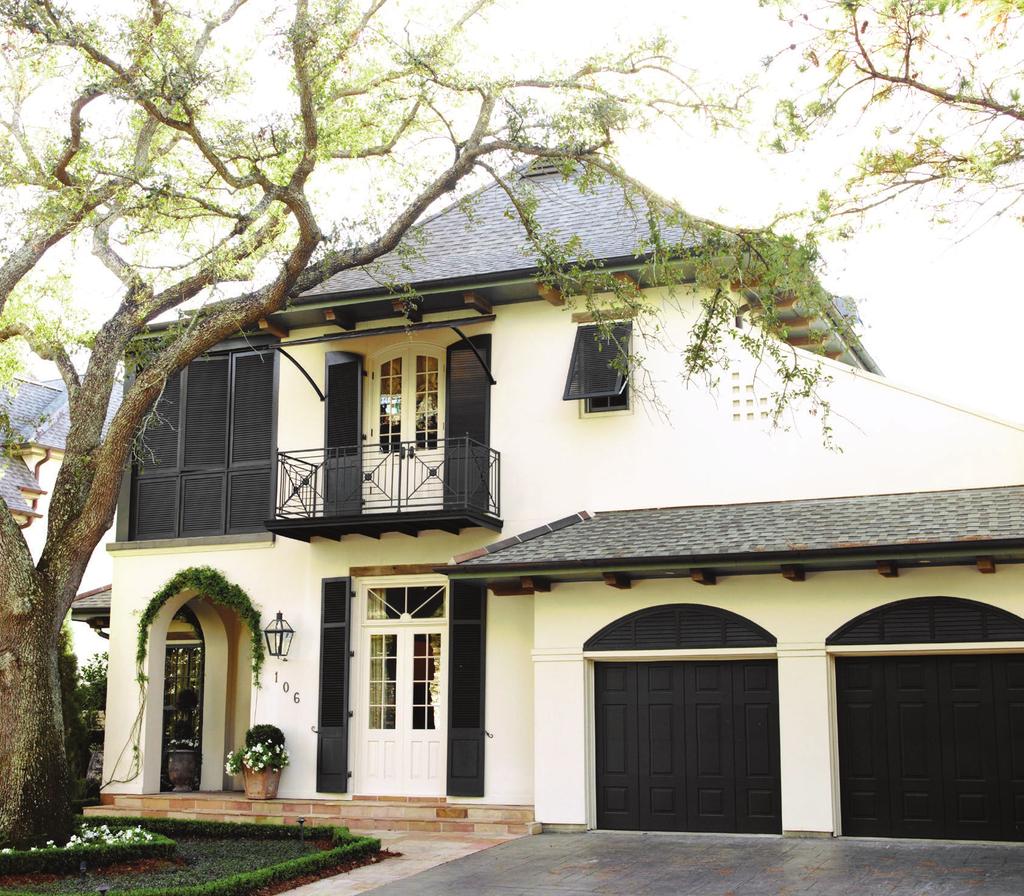 LEFT: A grand oak tree shades the front facade of the Nelsons West Indies-style home. BELOW: Virginia finds country French style both elegant and familyfriendly.