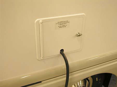 Route power cord through notch and close door while shoreline is connected to outlet.