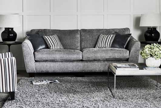 Charlie C O L L E C T I O N Slim high arm rests combined with studded detailing gives the Charlie Sofa Collection a stylish and