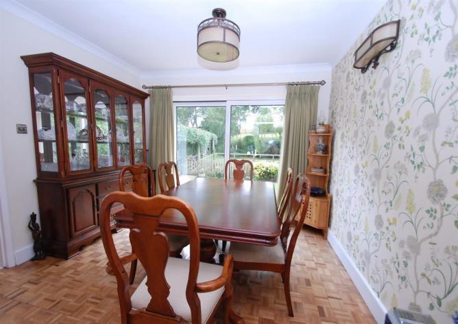 -4' Sitting room with feature fireplace housing log burning stove. - Large dining room / Snug overlooking the rear garden. - Large upvc conservatory overlooking rear garden.