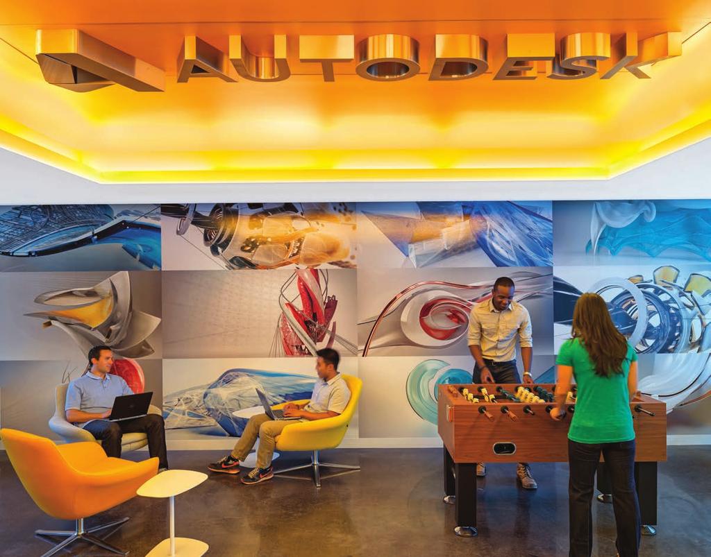 AUTODESK GAME ROOM In the game room a popular social node in high-tech office settings a dimensional 3D Autodesk logo is mounted on a recessed orange color surface, lit around the perimeter with