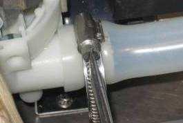 Slacken the stainless hose clamp holding