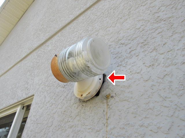 2.0 (2) Gap visible on wall around exterior light fixture at the rear of the home.