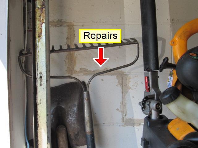 1 (2) Hairline cracks visible on wall in one or more areas in the garage.