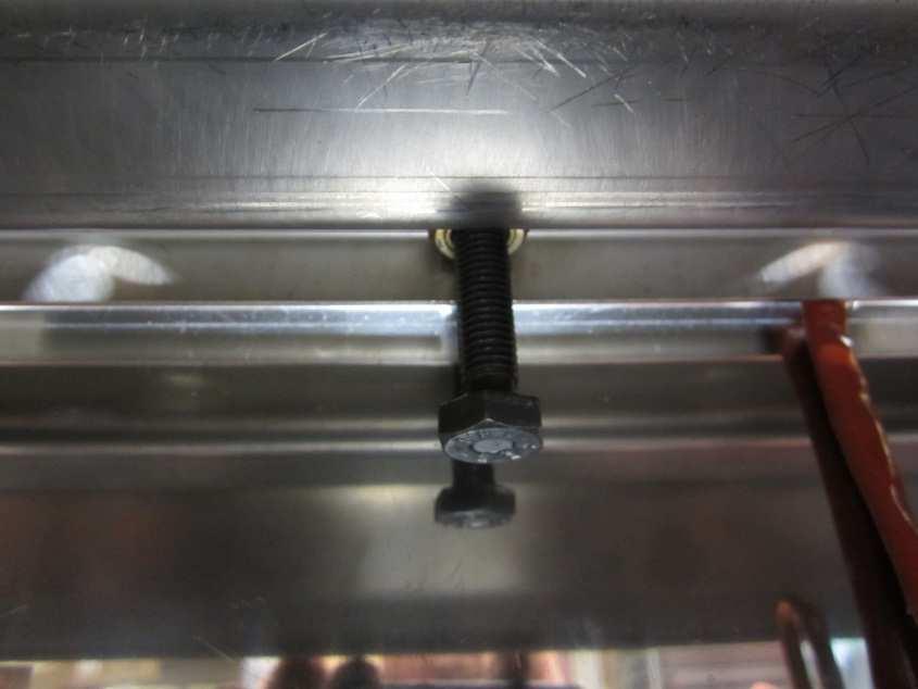 Tighten the central bolt (17mm spanner) to raise the plate to its high