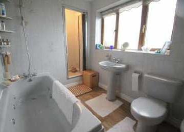 93m) Light grey suite with chrome fittings, panel enclosed spa bath with
