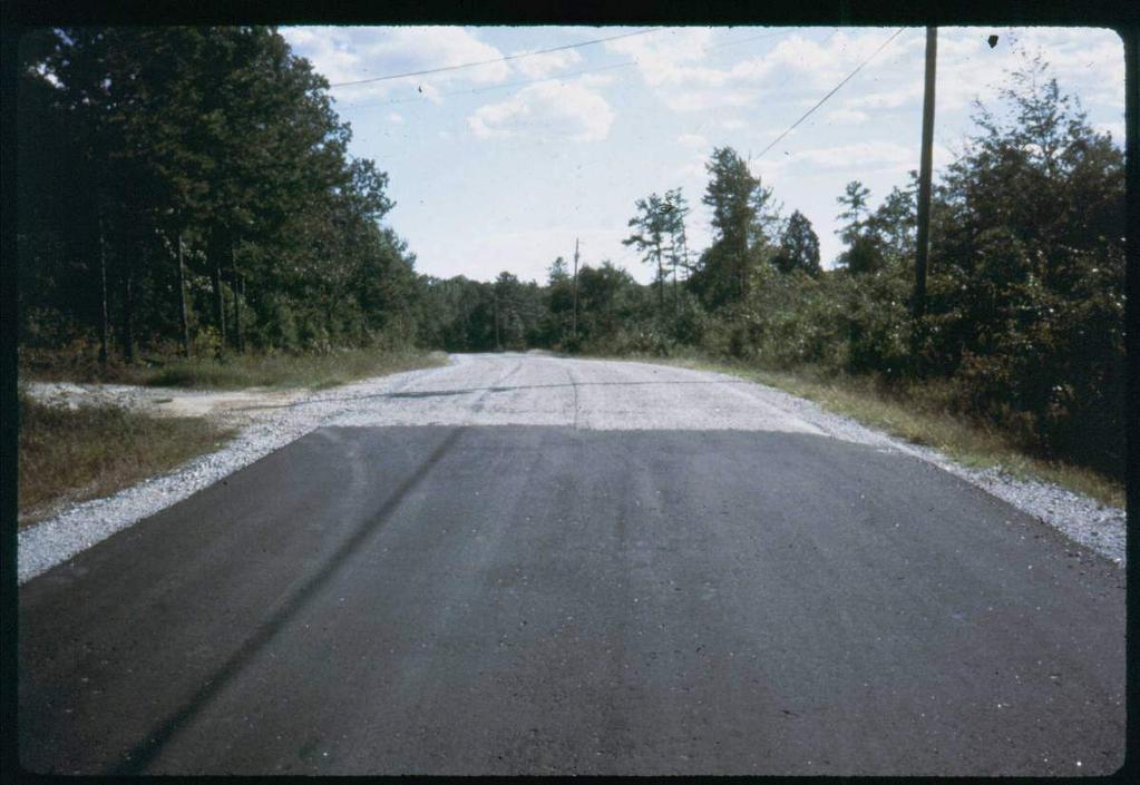 Surfacing A surface treatment such as an asphalt layer or a double or