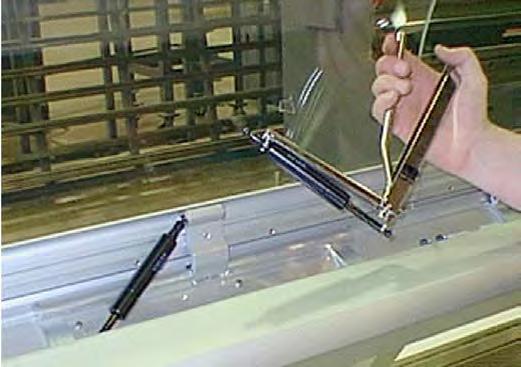 To prevent glass from falling during installation, use or maintenance and causing injury to customers or personnel, Hussmann recommends one person hold the glass in a raised position while the other