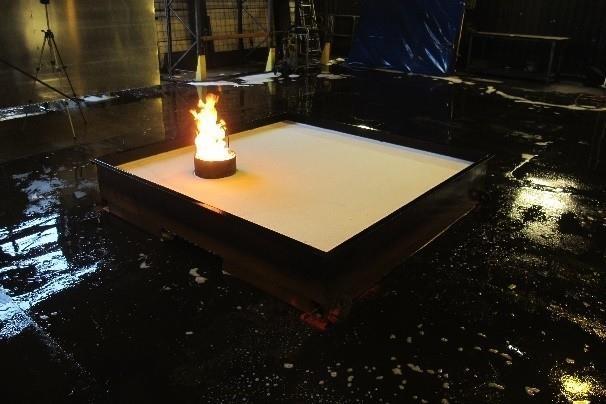 Figure 11: Fire testing in accordance with UL 162 of a foam-water spray system. Burn-back test conducted after the application of water spray on the blanket of foam.