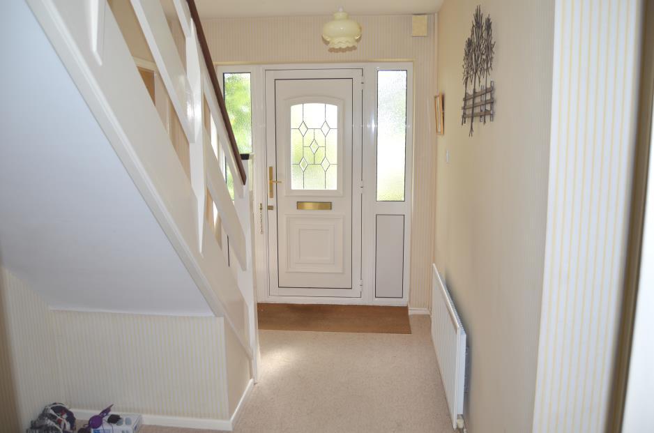 The Property Comprises Entrance: upvc front door with side panels into Reception Hall: mat well, panel radiator, ceiling lights, door chime, useful under stairs storage area, light points, Honeywell