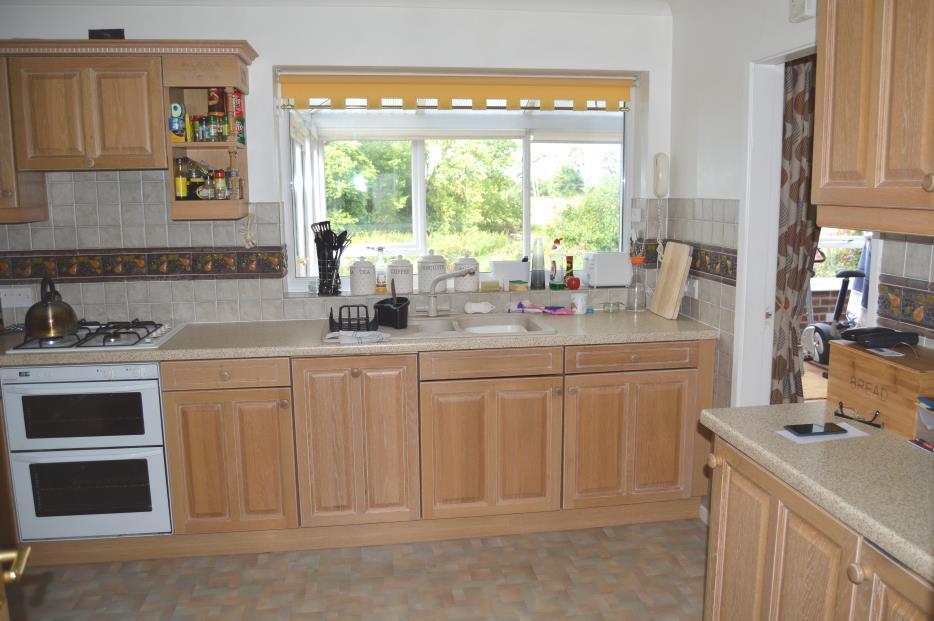 There are glazed double doors which lead out onto patio Kitchen: measuring approximately 10 3 x 11 0 (3.14m x 3.