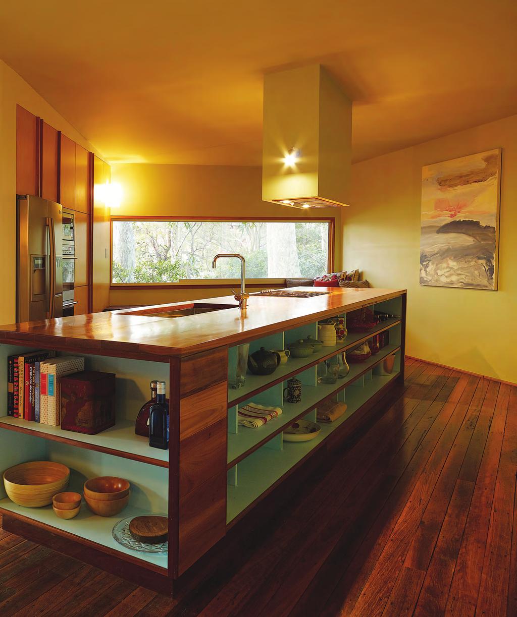 01 01 The island unit features built-in shelving, while also