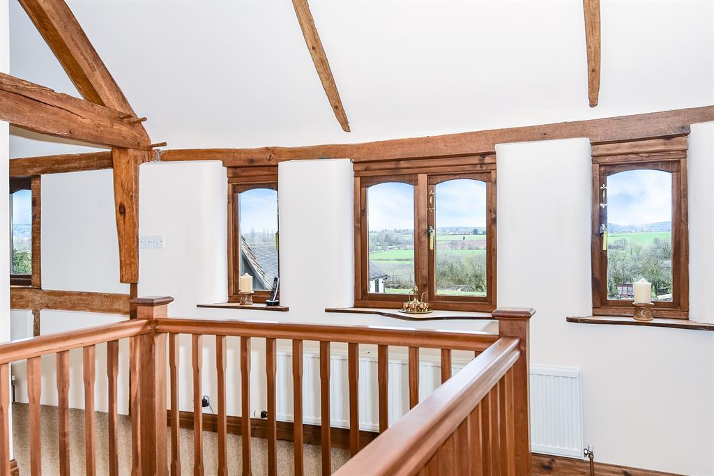 SELF CONTAINED ANNEXE with its own terrace and sitting area adjoining open countryside and comprising: - door to Hall with door to Sitting Room,