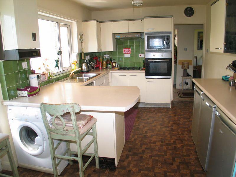 with mixer tap, built in electric oven, microwave, gas hob with overhead extractor hood,