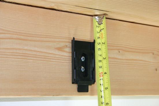 We recommend installing the brackets on the stud closest to each end of the shade, remembering to allow at least 2 inches (5.08 cm) from each end.