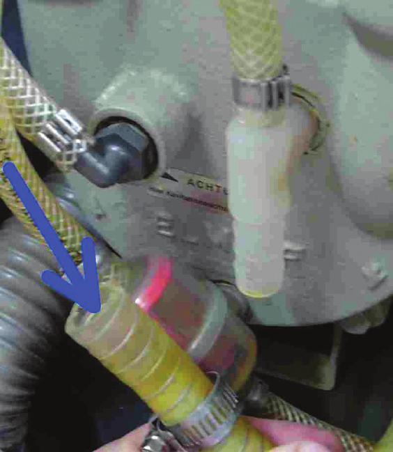 hose section Loosen hose clamp of return hose section and remove hose from screwed