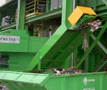 THE CLEANING CONVEYOR WITH CHAIN AND SCRAPERS IS INSTALLED AROUND THE PERIMETER OF THE BALER.