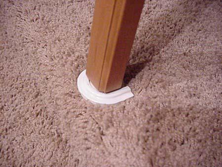 Reattach the table onto the wall support and lower the table leg.