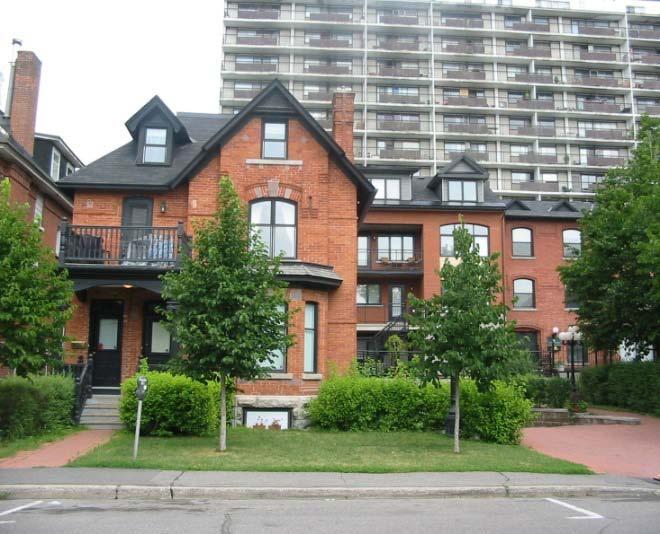 Figure 34: The red brick infill addition, which is set back and to the right of this neighbourhood building, blends into the