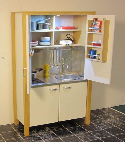 The right hand door has a rack for storing condiments and cook s ingredients, while the left hand door has a handy white board and marker. The unit is available in two versions.