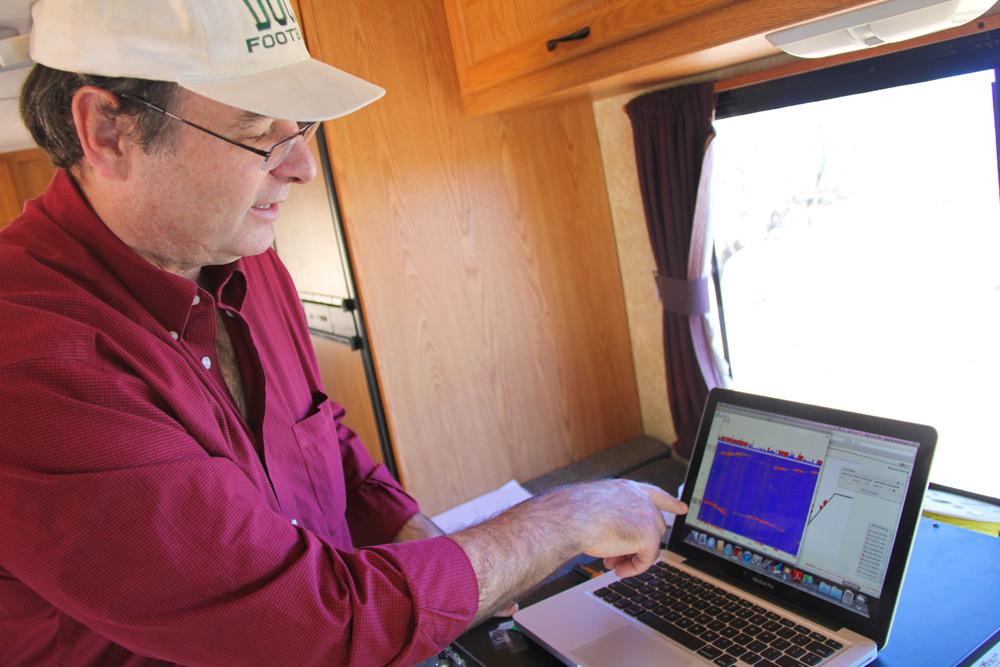 Art Scott Urquhart, Zonge Engineering president and senior geophysicist, monitors the Helios system housed