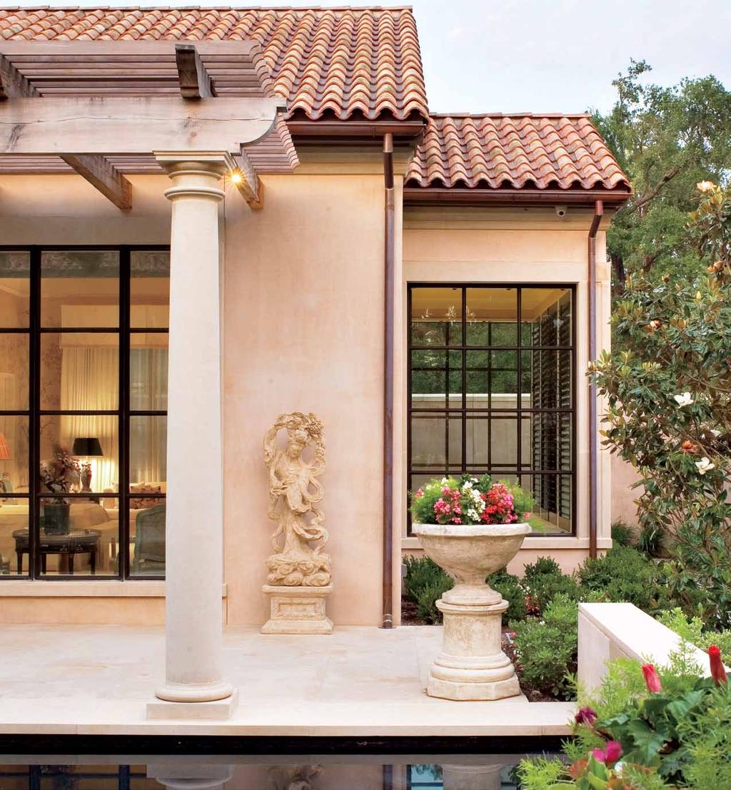 The same limestone flooring and columns from inside were carried outside to create a seamless transition.