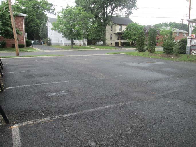 The parking lot can be partially redone with pervious pavement to capture this runoff as well as some of the roof runoff.