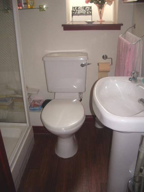 BATHROOM Approx: 6 4 x 5 6 Fitted with a white suite comprising WC, wash hand basin and