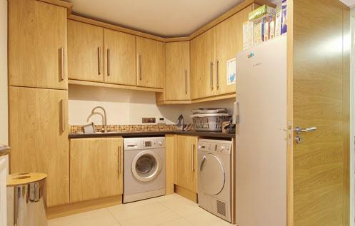 UTILITY ROOM: 11' 10" x 7' 10" (3.6m x 2.4m) Range of high and low level units, laminate worktop, stainless steel 1.