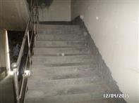 Handrails are provided on both sides of each stairway. Intermediate handrails are provided when the stair width exceeds 2.2 m (87 in.). Handrails are not mounted lower than 760 mm (30 in.