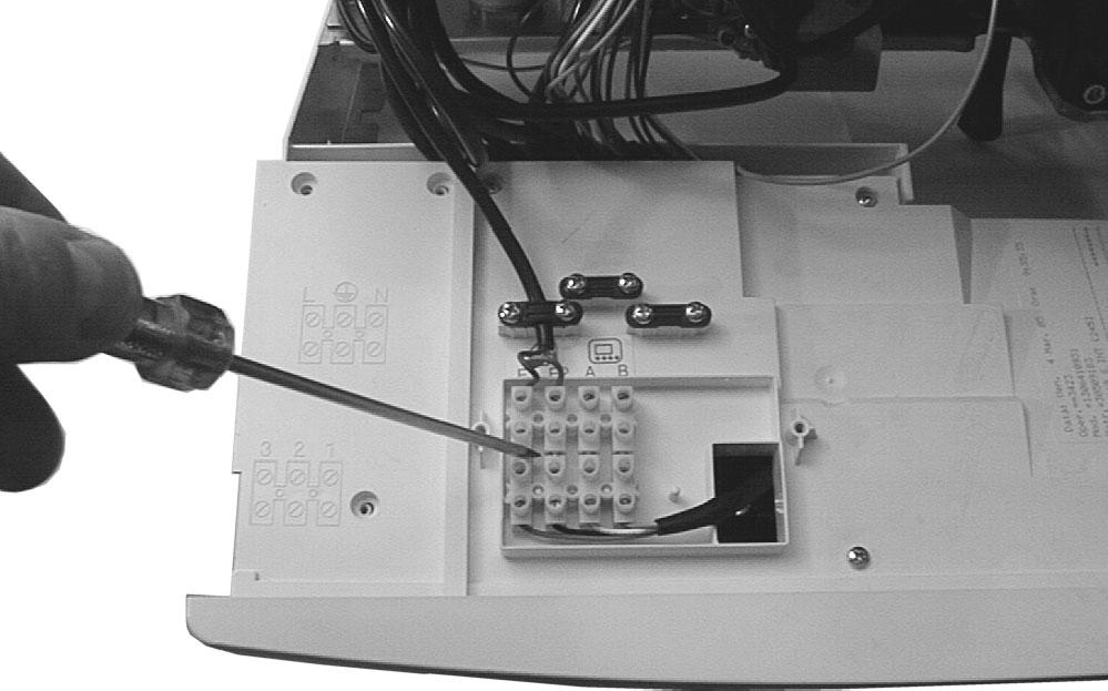 General access and emptying hydraulic circuits 9 Pass the terminal block connected to the boiler through the hole of the control panel lid (Fig. 2.